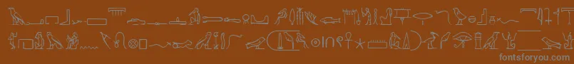 フォントPharoahGlyphMedium – 茶色の背景に灰色の文字