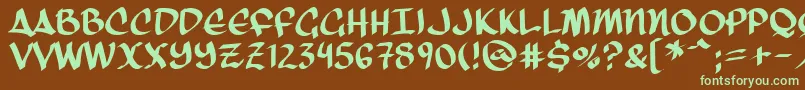 フォントThreeArrows – 緑色の文字が茶色の背景にあります。