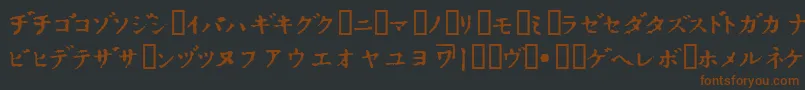 フォントInKatak – 黒い背景に茶色のフォント