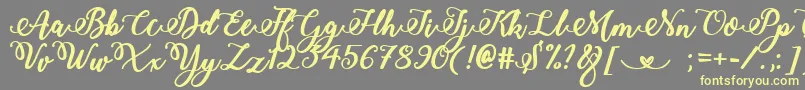 Weitere Informationen zur BoldStylishCalligraphy-Schriftart BoldStylishCalligraphy-Schriftart – Gelbe Schriften auf grauem Hintergrund