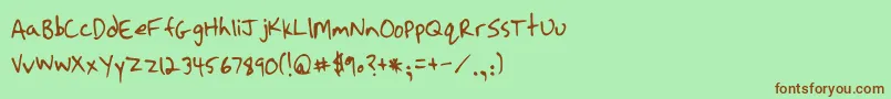 フォントStrassmanScript – 緑の背景に茶色のフォント