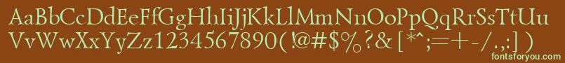 フォントGoudiold – 緑色の文字が茶色の背景にあります。