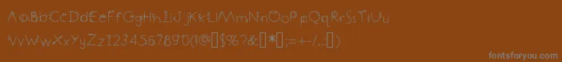 DecemberDeco Font – Gray Fonts on Brown Background