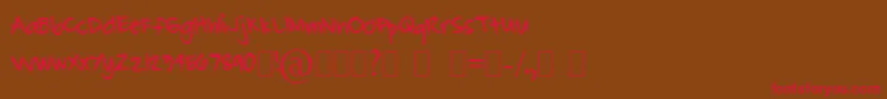 CarlJohn Font – Red Fonts on Brown Background