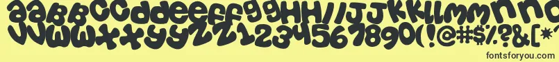 Tosscasu Font – Black Fonts on Yellow Background