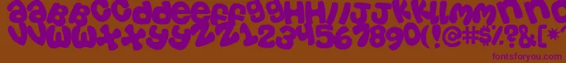 Tosscasu-Schriftart – Violette Schriften auf braunem Hintergrund