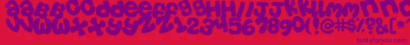 Tosscasu Font – Purple Fonts on Red Background