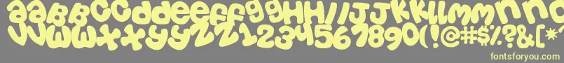 Tosscasu Font – Yellow Fonts on Gray Background