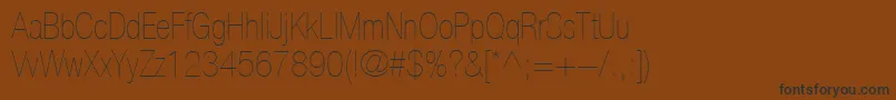 Шрифт HelveticaLt27UltraLightCondensed – чёрные шрифты на коричневом фоне