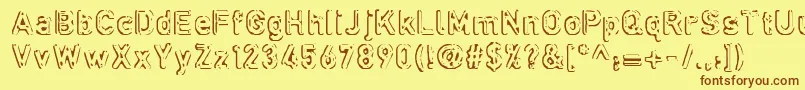 フォントDefora ffy – 茶色の文字が黄色の背景にあります。