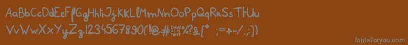 Daveulmfont Font – Gray Fonts on Brown Background