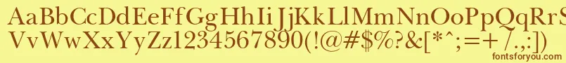 フォントPasmac – 茶色の文字が黄色の背景にあります。