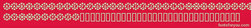 Weitere Informationen zur KrWreathOfHearts-Schriftart KrWreathOfHearts-Schriftart – Grüne Schriften auf rotem Hintergrund