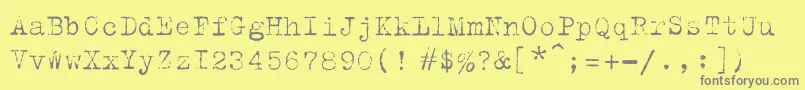 TrixiecyrLight-fontti – harmaat kirjasimet keltaisella taustalla