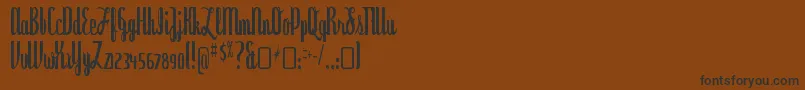 フォントDyspepsiaRegular – 黒い文字が茶色の背景にあります