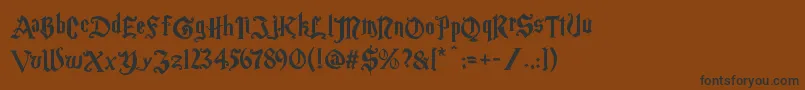 Шрифт Magic School One – чёрные шрифты на коричневом фоне