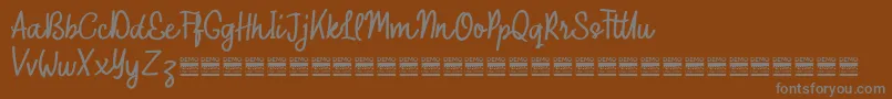 OuterlordDemo Font – Gray Fonts on Brown Background