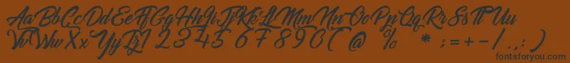 GoldfingerKingdom Font – Black Fonts on Brown Background