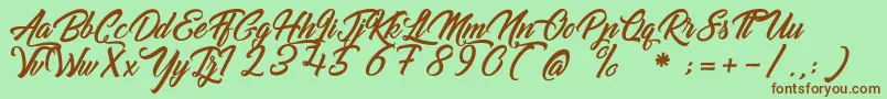 GoldfingerKingdom Font – Brown Fonts on Green Background