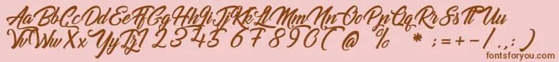 GoldfingerKingdom Font – Brown Fonts on Pink Background
