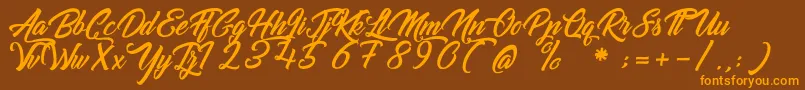 GoldfingerKingdom Font – Orange Fonts on Brown Background