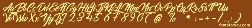 GoldfingerKingdom Font – Yellow Fonts on Brown Background