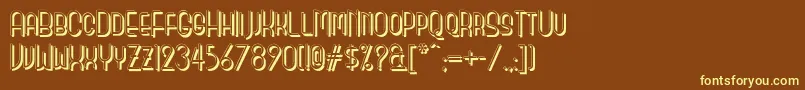 Monicassalonshadownf-fontti – keltaiset fontit ruskealla taustalla