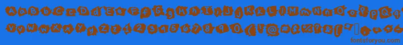 フォントMissTerious – 茶色の文字が青い背景にあります。