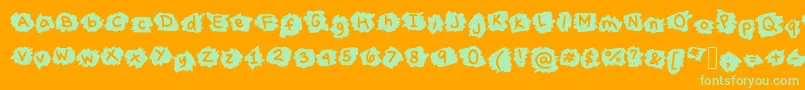 MissTerious Font – Green Fonts on Orange Background