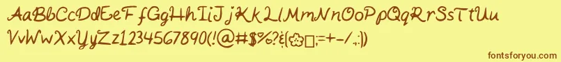 Fonte KaitSHandwriting – fontes marrons em um fundo amarelo