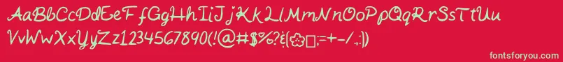 Fonte KaitSHandwriting – fontes verdes em um fundo vermelho