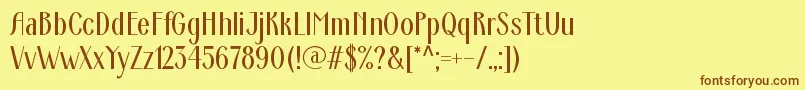 フォントArdeco – 茶色の文字が黄色の背景にあります。