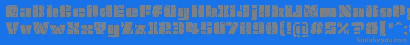 OvrkllGrunge-Schriftart – Graue Schriften auf blauem Hintergrund