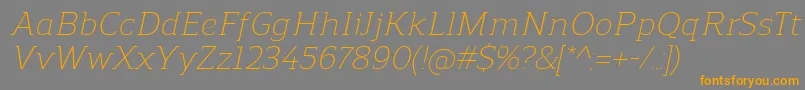 ReganslabLightitalic-Schriftart – Orangefarbene Schriften auf grauem Hintergrund