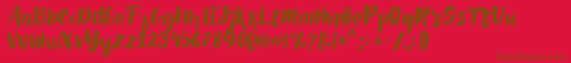 Fonte AlexdirteBrushFont – fontes marrons em um fundo vermelho