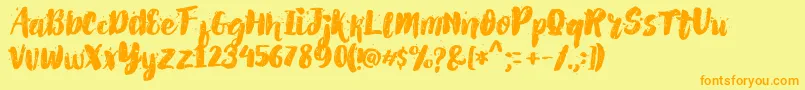 Czcionka AlexdirteBrushFont – pomarańczowe czcionki na żółtym tle