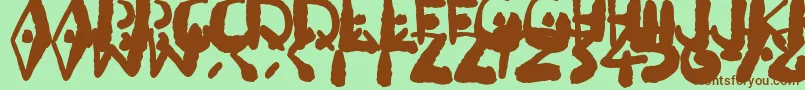 Fonte Inkbleeda – fontes marrons em um fundo verde