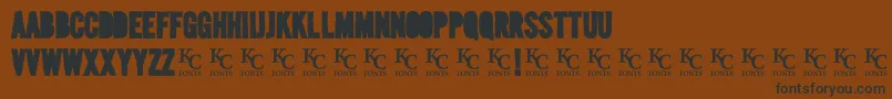 Mediablackoutdemo-fontti – mustat fontit ruskealla taustalla