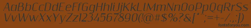 Шрифт Resagnictoitalic – чёрные шрифты на коричневом фоне