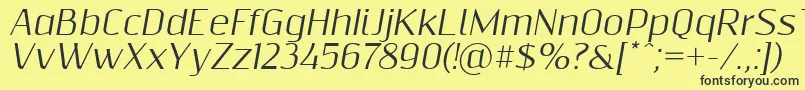 Шрифт Resagnictoitalic – чёрные шрифты на жёлтом фоне