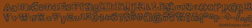 TheInterzone-Schriftart – Schwarze Schriften auf braunem Hintergrund
