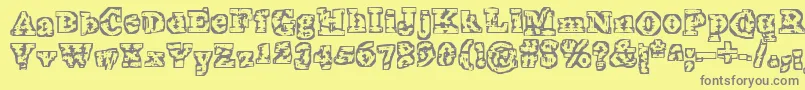 TheInterzone-fontti – harmaat kirjasimet keltaisella taustalla