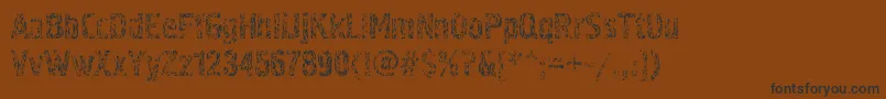 Pollock4c-Schriftart – Schwarze Schriften auf braunem Hintergrund