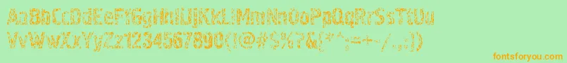 フォントPollock4c – オレンジの文字が緑の背景にあります。