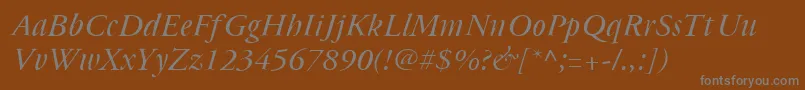Cyrillicgaramond Italic-fontti – harmaat kirjasimet ruskealla taustalla