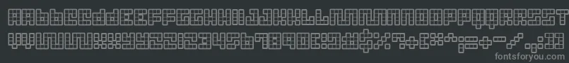 Tricb-fontti – harmaat kirjasimet mustalla taustalla
