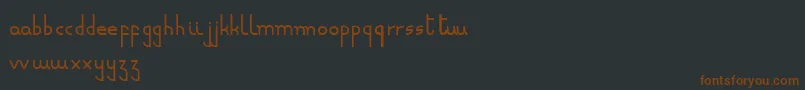 Fonte Minusculeregular – fontes marrons em um fundo preto