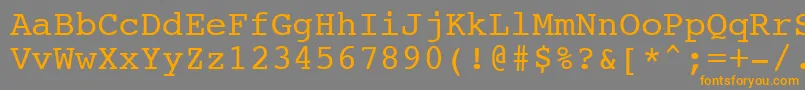 フォントNtcouriervkNormaloblique – オレンジの文字は灰色の背景にあります。