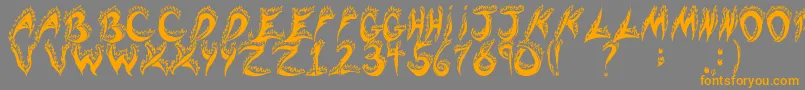 フォントFlamingTears – オレンジの文字は灰色の背景にあります。