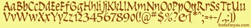 フォントInsula – 茶色の文字が黄色の背景にあります。